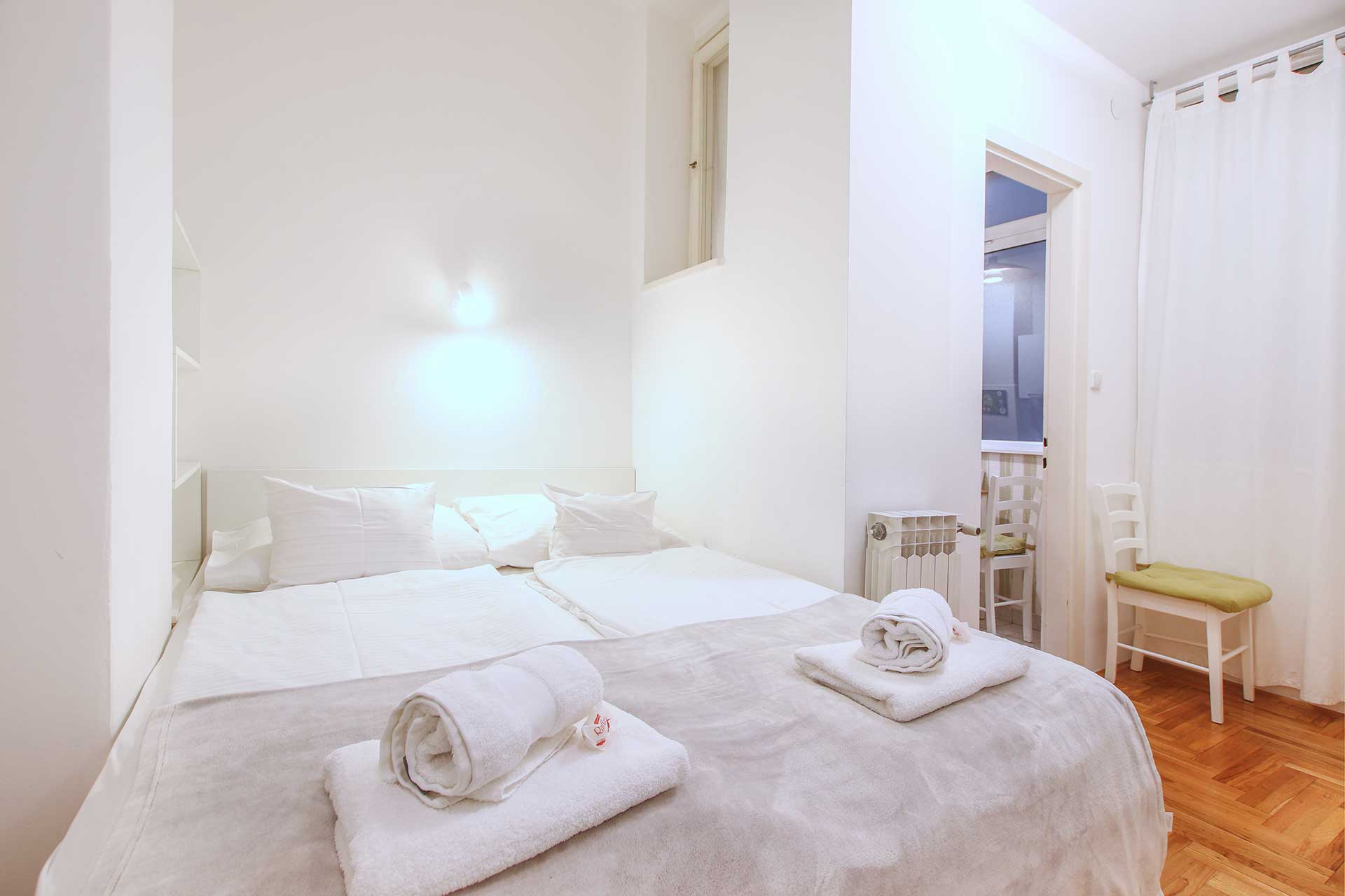 Bedroom with double bed and fresh towels