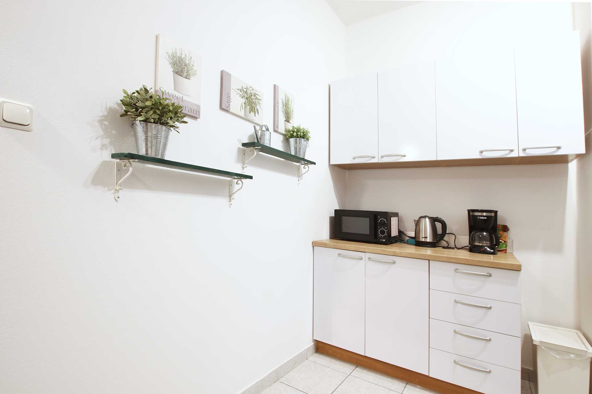 Kitchen with oven, kettle and worktop